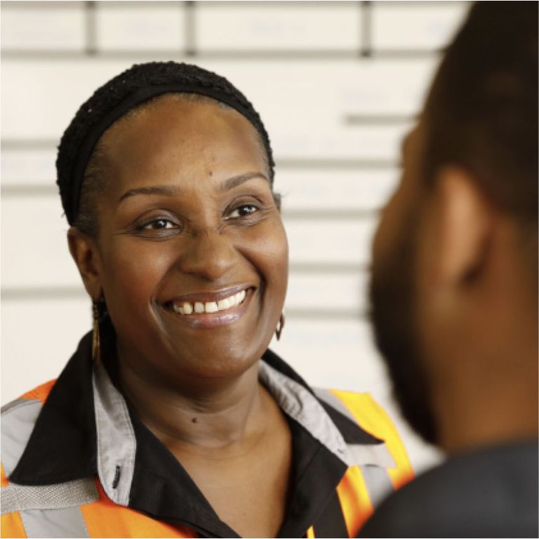 A smiling XPO employee