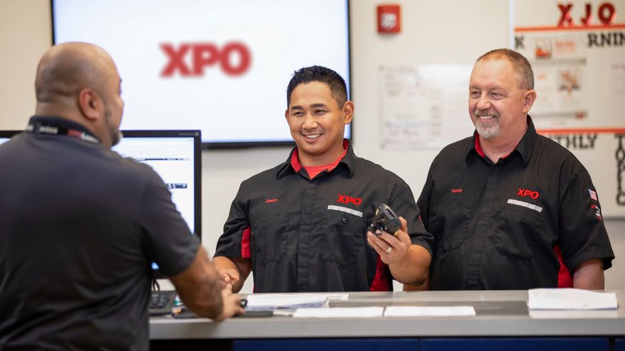 Two employees smiling at each other
