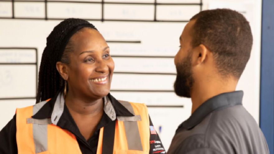 Opportunities for growth Two employees smiling at each other