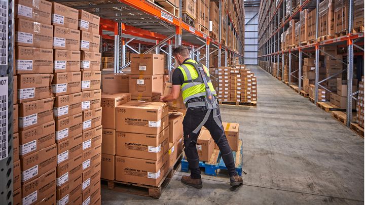XPO rolls out exoskeleton trial warehouse employee wearing exoskeleton