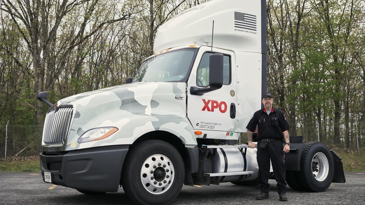 Military Appreciation Trucks Driver standing in front of truck